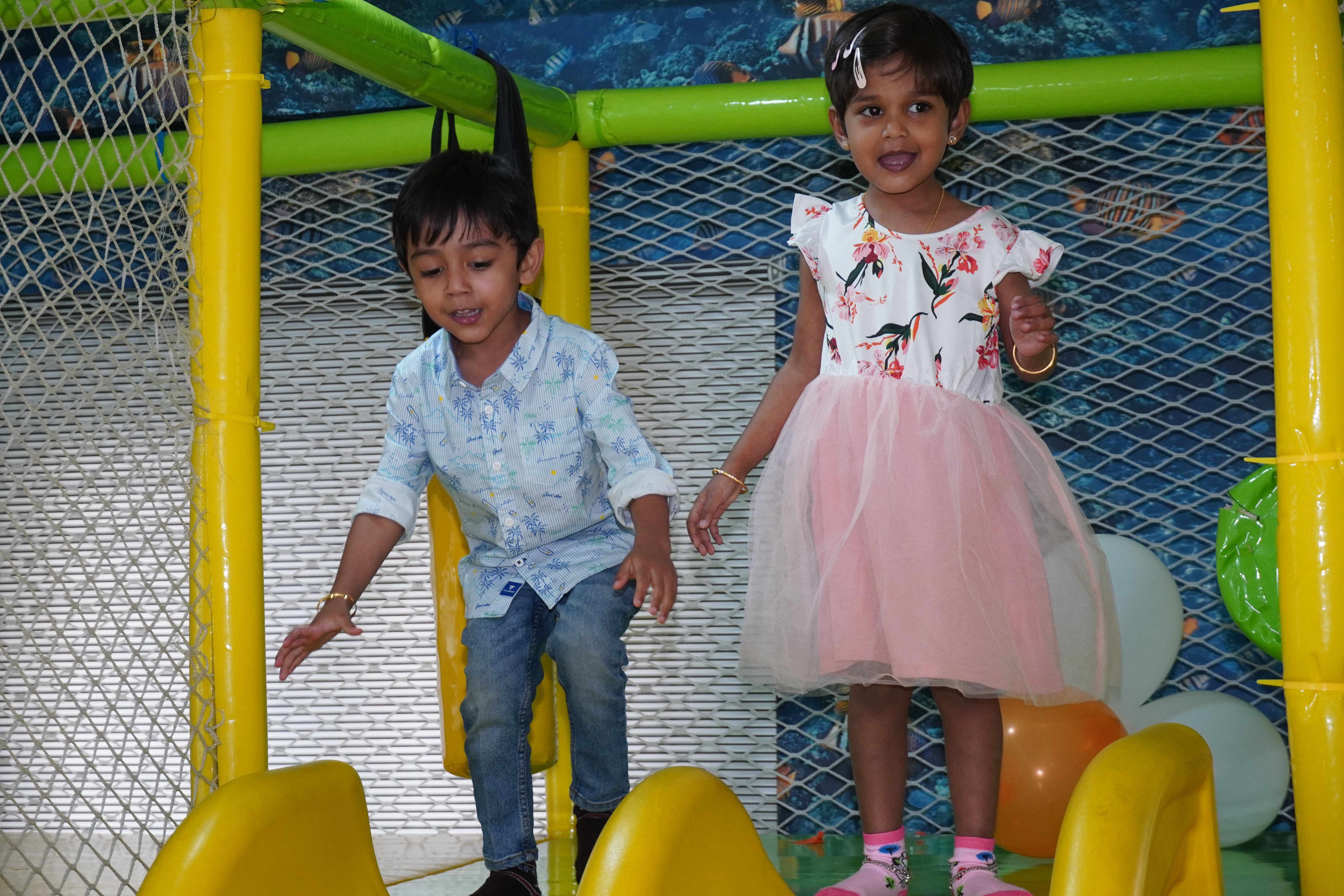 Kids playing in colorful ball pit
